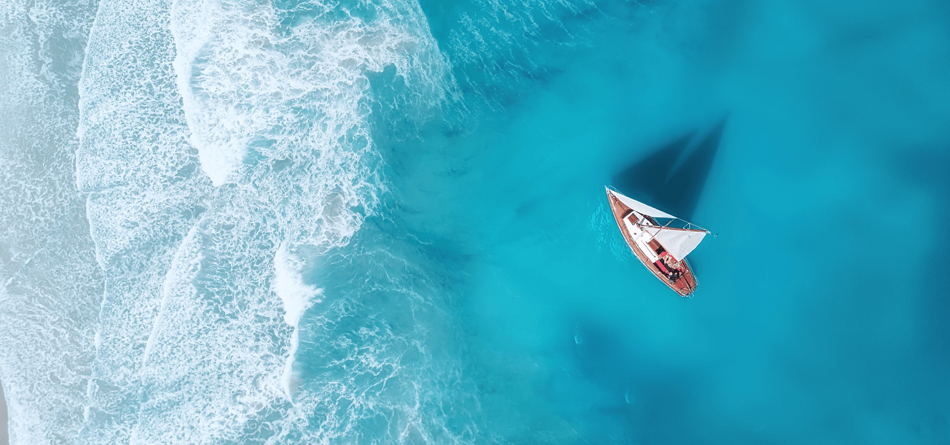 Yacht on the water surface from top view